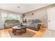 Spacious living room with hardwood floors, cozy sofas, and a decorative coffee table at 1962 English Dr, Deltona, FL 32738