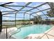 Relax poolside in this refreshing in ground pool, enhanced by a screened enclosure and scenic lake views at 1962 English Dr, Deltona, FL 32738