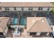 An aerial view of pool patios with pools and outdoor seating at 1979 Majorca Dr, Kissimmee, FL 34747