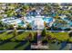 Aerial view of community pool, waterpark, and lake at 1979 Majorca Dr, Kissimmee, FL 34747
