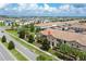Inviting community setting with lush landscaping, a fountain, and well-maintained townhomes at 1979 Majorca Dr, Kissimmee, FL 34747