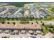 Aerial view of townhomes with private screened-in patios, landscaping, and community amenities at 1979 Majorca Dr, Kissimmee, FL 34747