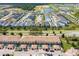 Aerial view of townhomes with private screened-in patios, landscaping, and community amenities at 1979 Majorca Dr, Kissimmee, FL 34747