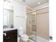 Bathroom with a tiled shower, sleek fixtures, and a modern vanity, providing a clean, functional space at 1979 Majorca Dr, Kissimmee, FL 34747