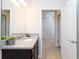 Elegant bathroom with a modern sink, a granite countertop, and bright neutral tiling at 1979 Majorca Dr, Kissimmee, FL 34747