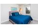 Inviting bedroom featuring a plush bed with stylish lighting and a bright window view at 1979 Majorca Dr, Kissimmee, FL 34747