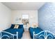 Cozy bedroom with twin beds, mermaid wallpaper, and ample natural light from the bright window at 1979 Majorca Dr, Kissimmee, FL 34747