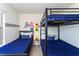 Comfortable bedroom with twin beds, featuring a bunkbed and stylish decor creating a fun atmosphere at 1979 Majorca Dr, Kissimmee, FL 34747