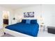 Comfortable bedroom featuring blue bedding, with tasteful decorations and adjoining bath, creating a cozy retreat at 1979 Majorca Dr, Kissimmee, FL 34747