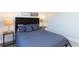 Neutral bedroom with a soft bed and minimalistic decor, perfect for relaxation at 1979 Majorca Dr, Kissimmee, FL 34747