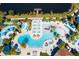 High angle shot of community pool and splash pad area, which includes plenty of lounge seating and play equipment at 1979 Majorca Dr, Kissimmee, FL 34747