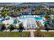 A lovely community pool area, featuring slides, cabanas, and chairs for lounging around the sparkling blue pool at 1979 Majorca Dr, Kissimmee, FL 34747