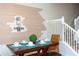Bright dining area featuring a modern table and unique horizontal plank wall decor at 1979 Majorca Dr, Kissimmee, FL 34747