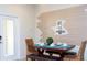 Bright dining space with a modern table set and unique horizontal plank wall decor at 1979 Majorca Dr, Kissimmee, FL 34747