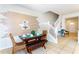 Dining area featuring a modern table, stylish decor, and access to the staircase at 1979 Majorca Dr, Kissimmee, FL 34747