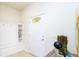 Well-lit entryway featuring a built-in storage bench and a bright white door at 1979 Majorca Dr, Kissimmee, FL 34747