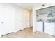 Functional laundry area with a washer, dryer, and storage, neatly tucked away in a closet near the hallway at 1979 Majorca Dr, Kissimmee, FL 34747