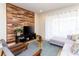 Inviting living room showcasing a wood-accent wall, stylish furniture, and a relaxing atmosphere at 1979 Majorca Dr, Kissimmee, FL 34747