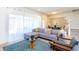 Bright and airy living room with plush sectional sofa, stylish accents, and abundant natural light at 1979 Majorca Dr, Kissimmee, FL 34747