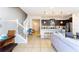 Open concept living space flows into a modern kitchen with stainless steel appliances at 1979 Majorca Dr, Kissimmee, FL 34747