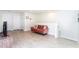 Cozy loft with neutral walls, wood-look floors, and a comfortable loveseat at 1979 Majorca Dr, Kissimmee, FL 34747