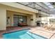 Pool patio with a table, BBQ, and seating at 1979 Majorca Dr, Kissimmee, FL 34747