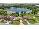 Aerial view of a charming neighborhood with lake access and lush greenery at 2028 Lake Christie Dr, Orlando, FL 32809