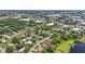 Picturesque aerial view of a residential community with lush greenery and commercial areas nearby at 2028 Lake Christie Dr, Orlando, FL 32809