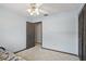 Bedroom with carpeted floor, ceiling fan, closet with louvered doors and en suite access at 2028 Lake Christie Dr, Orlando, FL 32809