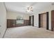 Spacious bedroom featuring wood paneling, large window view and double closets at 2028 Lake Christie Dr, Orlando, FL 32809