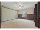 Cozy bedroom with a ceiling fan, carpeting, and light walls at 2028 Lake Christie Dr, Orlando, FL 32809