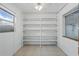 Walk-in closet with windows and built-in shelves at 2028 Lake Christie Dr, Orlando, FL 32809