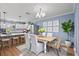 Open dining area with modern chandelier, stylish chairs, and charming accents at 2028 Lake Christie Dr, Orlando, FL 32809