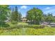 Lush property with dock and lilypad pond offers a tranquil setting and charming waterfront appeal at 2028 Lake Christie Dr, Orlando, FL 32809