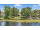 Lush property with dock and lilypad pond offers a tranquil setting and charming waterfront appeal at 2028 Lake Christie Dr, Orlando, FL 32809