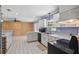 Bright kitchen with white cabinets and a spacious design, complemented by wood paneling at 2028 Lake Christie Dr, Orlando, FL 32809