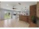 Spacious kitchen boasts a breakfast bar and double doors to backyard at 2028 Lake Christie Dr, Orlando, FL 32809