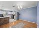 Bright eat-in kitchen with white cabinets, stainless steel appliances and light blue walls at 2028 Lake Christie Dr, Orlando, FL 32809