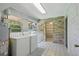 Bright laundry room featuring a washer, dryer, and view of the water at 2028 Lake Christie Dr, Orlando, FL 32809