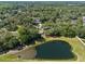 Aerial view featuring a tranquil lake surrounded by lush green landscape at 216 San Fernando Ct, Sanford, FL 32773