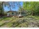 Inviting backyard with spacious deck and sunroom, perfect for outdoor living at 216 San Fernando Ct, Sanford, FL 32773