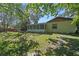 Lush backyard with a screened patio, offering a serene outdoor escape at 216 San Fernando Ct, Sanford, FL 32773