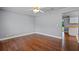 Cozy bedroom with hardwood floors, a ceiling fan, and a neutral color scheme at 216 San Fernando Ct, Sanford, FL 32773