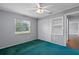 Cozy bedroom with a ceiling fan, closet space, and a window overlooking the street at 216 San Fernando Ct, Sanford, FL 32773