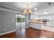 View of a kitchen with white cabinets, wooden countertop, stainless steel appliances and a sliding glass door to the yard at 216 San Fernando Ct, Sanford, FL 32773