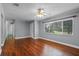 Bright living room with hardwood floors, a ceiling fan, and an open doorway at 216 San Fernando Ct, Sanford, FL 32773