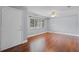 Bright living room featuring hardwood floors, a ceiling fan, and a large window at 216 San Fernando Ct, Sanford, FL 32773