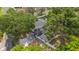 An aerial view showcases this single Gathering home surrounded by mature trees and a long driveway at 22 Hillcrest Dr, Babson Park, FL 33827