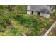 This backyard features a spacious lawn and partial fencing, perfect for outdoor activities and relaxation at 22 Hillcrest Dr, Babson Park, FL 33827
