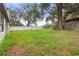 Spacious backyard with healthy green grass at 22 Hillcrest Dr, Babson Park, FL 33827